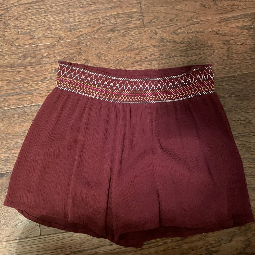 Red shorts with detailing